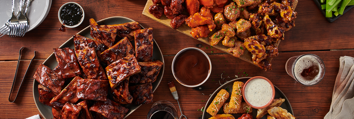 TGI Fridays catering spread with appetizers and platters