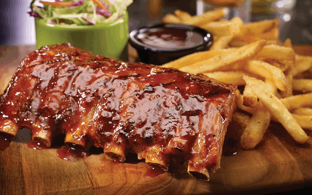Fall-off-the-bone Big Ribs with seasoned fries at TGI Fridays, the ultimate winter comfort food.