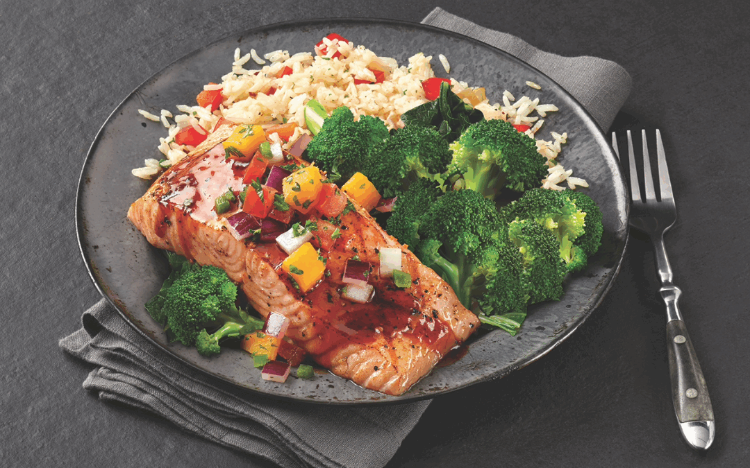 Dragon-glazed salmon with jasmine rice, garlic-butter broccoli, and fresh mango pico at TGI Fridays