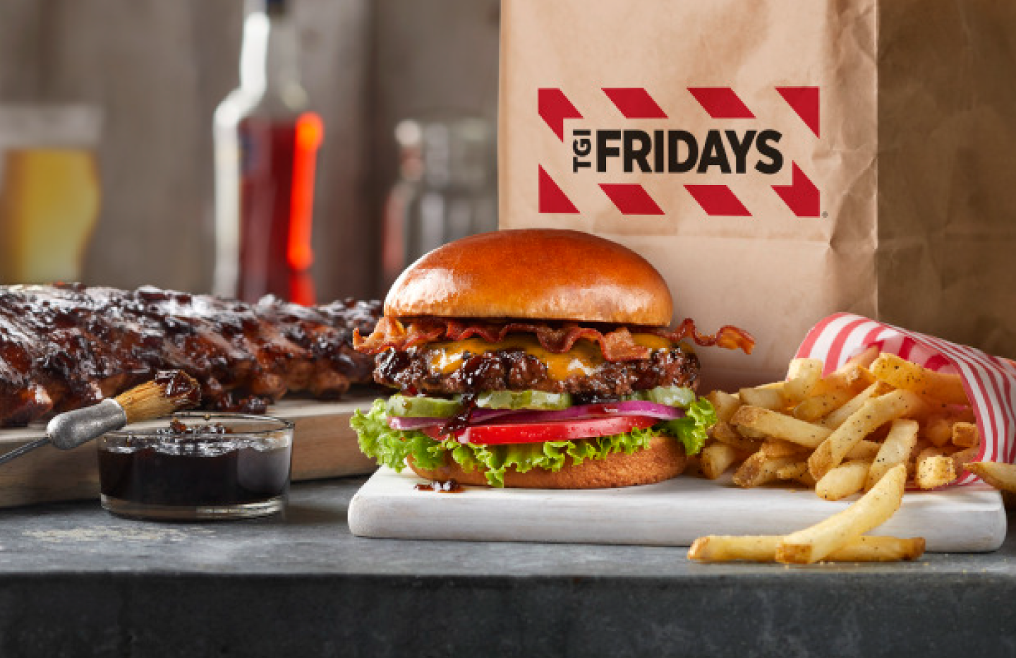 TGI Fridays burger fries and ribs available for online ordering and takeout